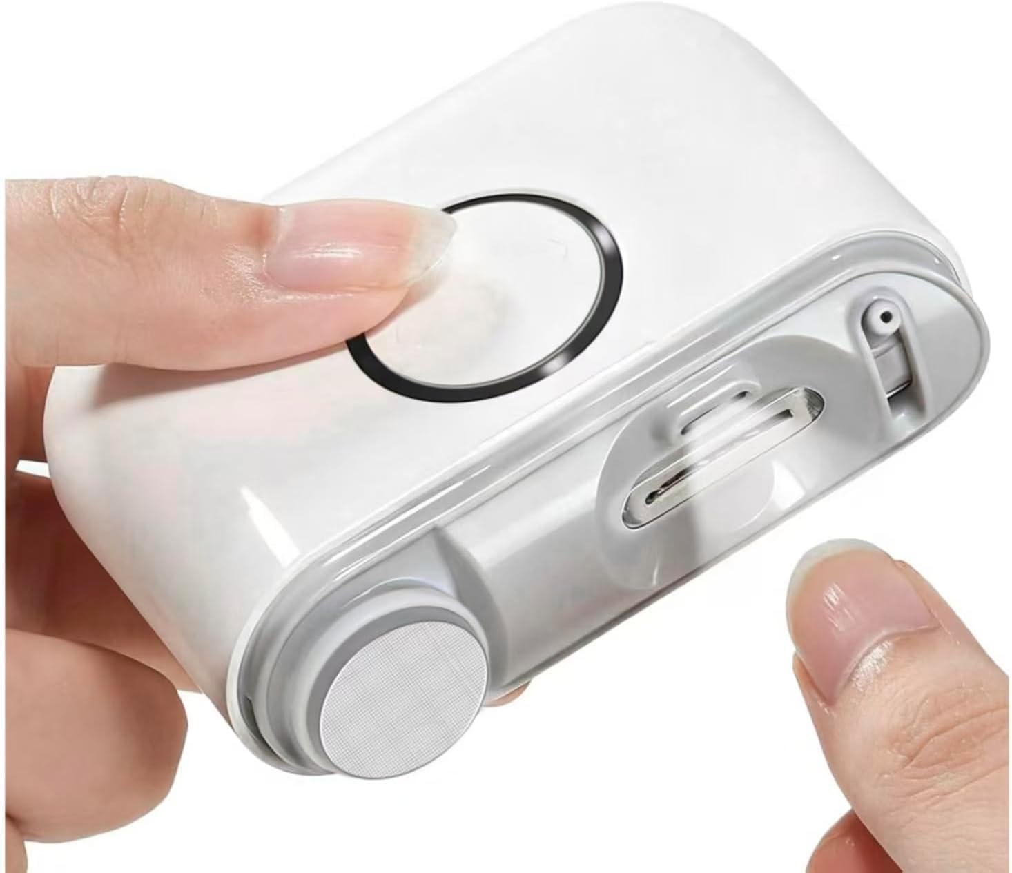 Electric nail clipper for precise grooming, shown in use by hand